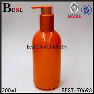 orange color plastic shampoo bottle with shampoo pump