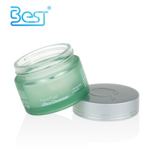 Green cosmetic frosted glass cream jar with metal lid